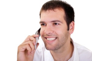 potrait of a youing man speaking on the phone